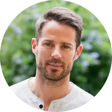 A smiling man with dark hair